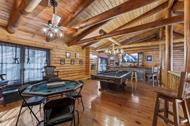 rec room with rustic walls, pool table, lofted ceiling with beams, hardwood / wood-style flooring, and ceiling fan