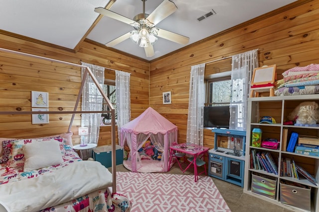 bedroom with wooden walls and ceiling fan