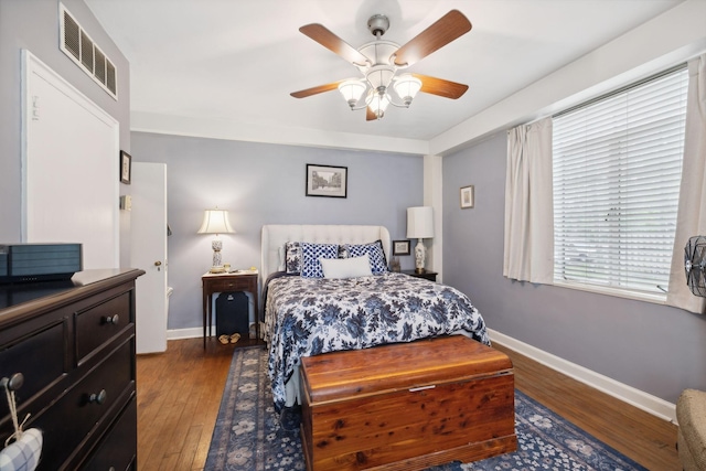 bedroom featuring dark hardwood / wood-style flooring and ceiling fan