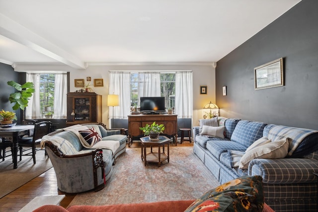 living room with hardwood / wood-style floors and beamed ceiling