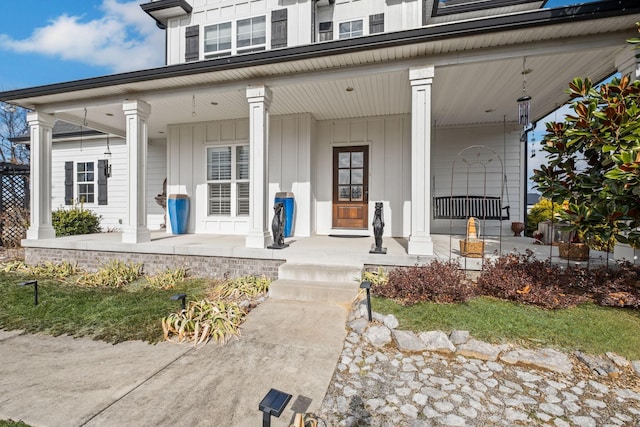 entrance to property featuring a porch