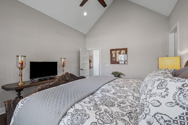 bedroom with ceiling fan and high vaulted ceiling