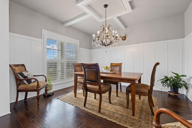 dining area with dark wood-type flooring and a chandelier