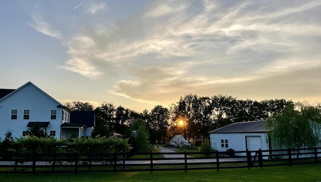 view of yard at dusk