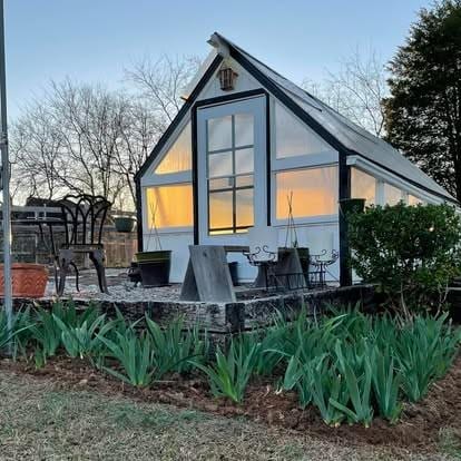 view of home's exterior with an outbuilding