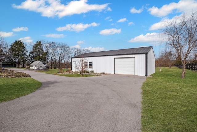 garage with a lawn