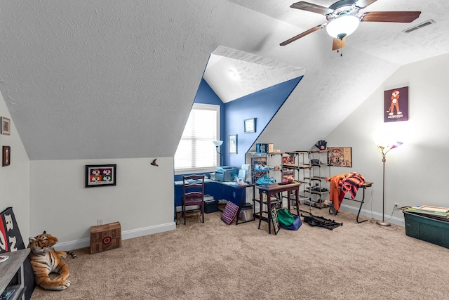 office space with vaulted ceiling, carpet floors, and a textured ceiling