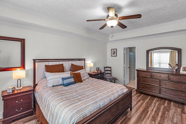 bedroom featuring ceiling fan, crown molding, a textured ceiling, and ensuite bath