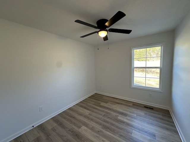 unfurnished room featuring wood-type flooring and ceiling fan