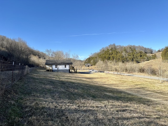 view of yard with a rural view