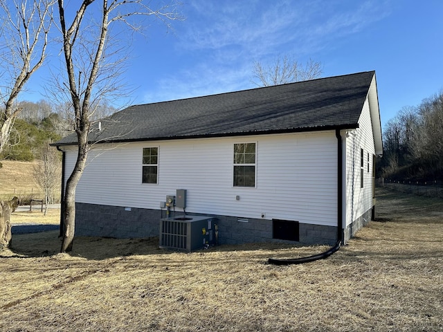 view of property exterior with central AC