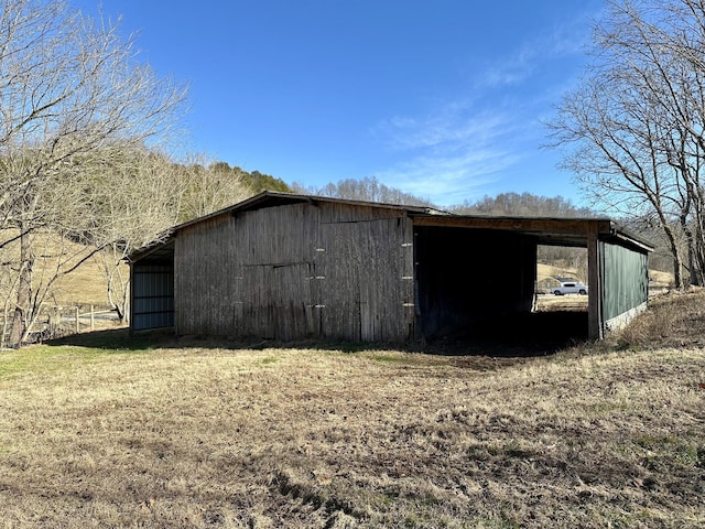 view of outbuilding with a lawn