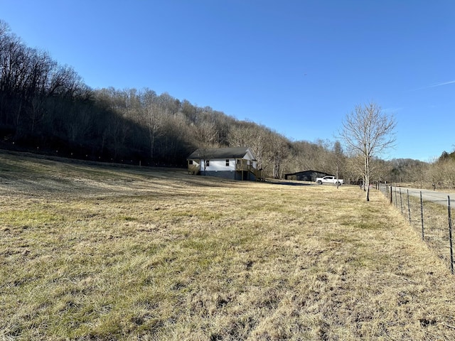 view of yard with a rural view