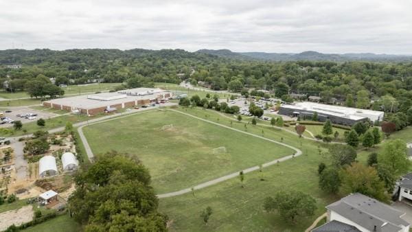 bird's eye view featuring a wooded view