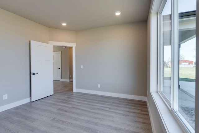 unfurnished room featuring light hardwood / wood-style floors