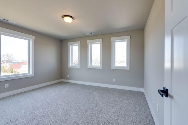 spare room featuring carpet