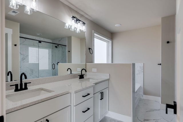 bathroom featuring vanity and separate shower and tub