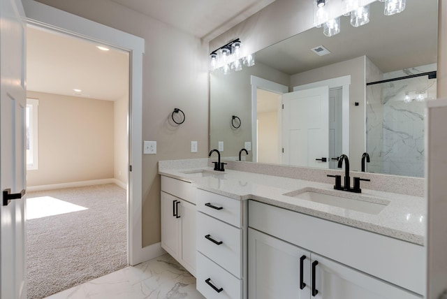 bathroom featuring vanity and an enclosed shower