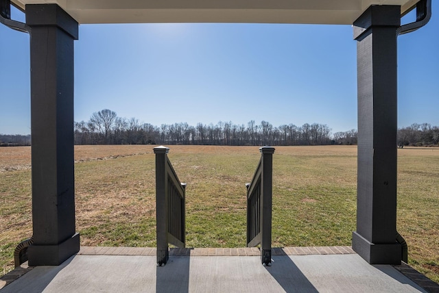 view of yard with a rural view