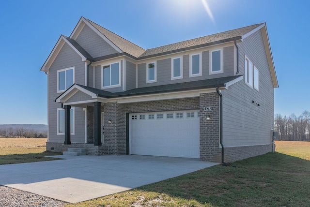 craftsman-style house with a garage and a front yard