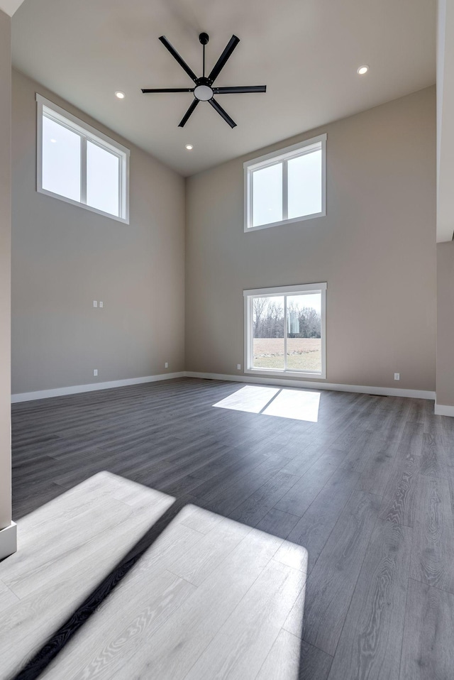 spare room with wood-type flooring and ceiling fan