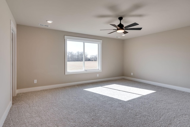 unfurnished room with carpet and ceiling fan