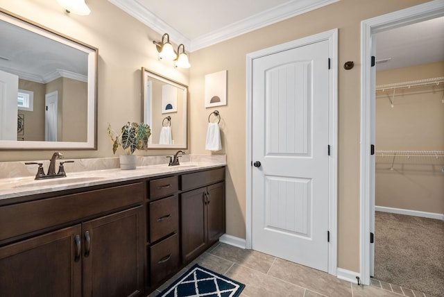 bathroom with crown molding, vanity, and tile patterned flooring