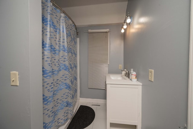 bathroom featuring vanity, tile patterned flooring, and a shower with shower curtain