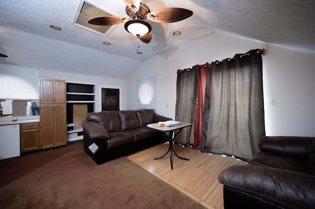 carpeted living room featuring lofted ceiling, ceiling fan, built in features, and a textured ceiling