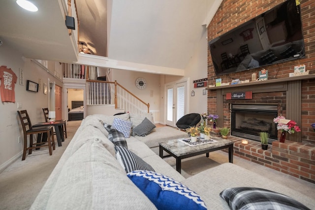 living room with light carpet, a brick fireplace, and vaulted ceiling