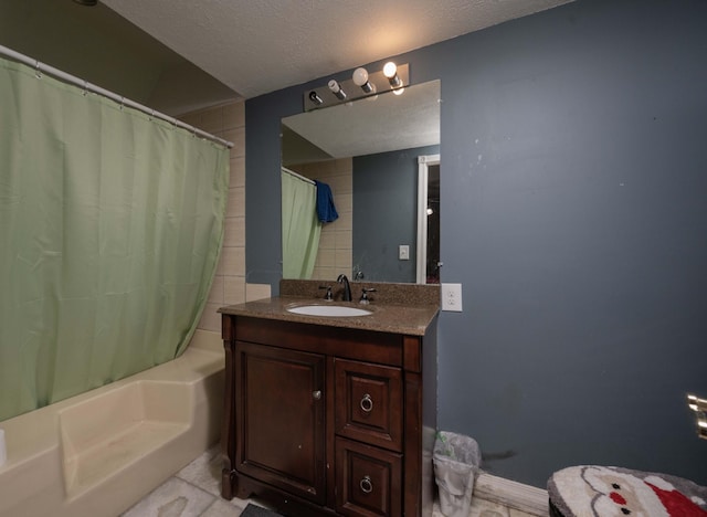 bathroom featuring vanity, shower / tub combo, and a textured ceiling