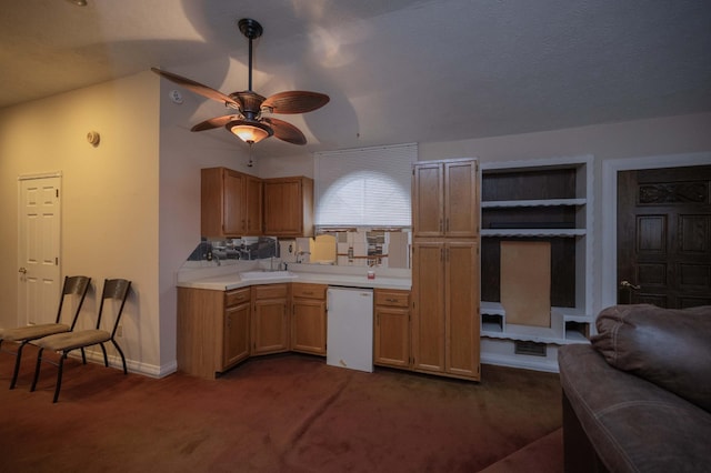 kitchen with sink, dishwasher, ceiling fan, light brown cabinetry, and dark carpet