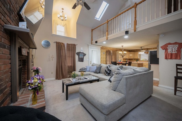 living room with a wealth of natural light, ceiling fan with notable chandelier, and a high ceiling