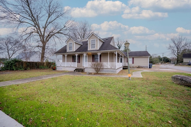 new england style home featuring a porch and a front yard