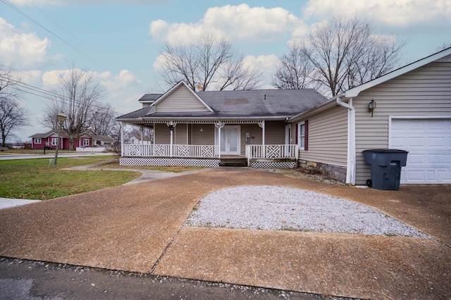 single story home featuring a porch and a garage