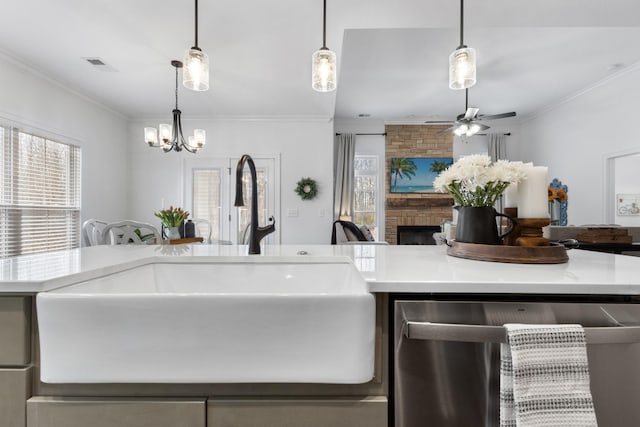 kitchen featuring crown molding, stainless steel dishwasher, a healthy amount of sunlight, and sink