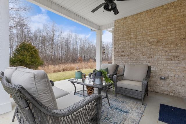 view of patio / terrace with ceiling fan and an outdoor living space