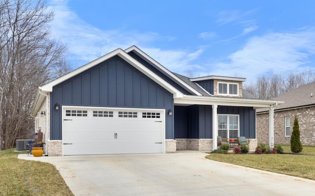 craftsman-style house with a porch, a garage, and a front yard