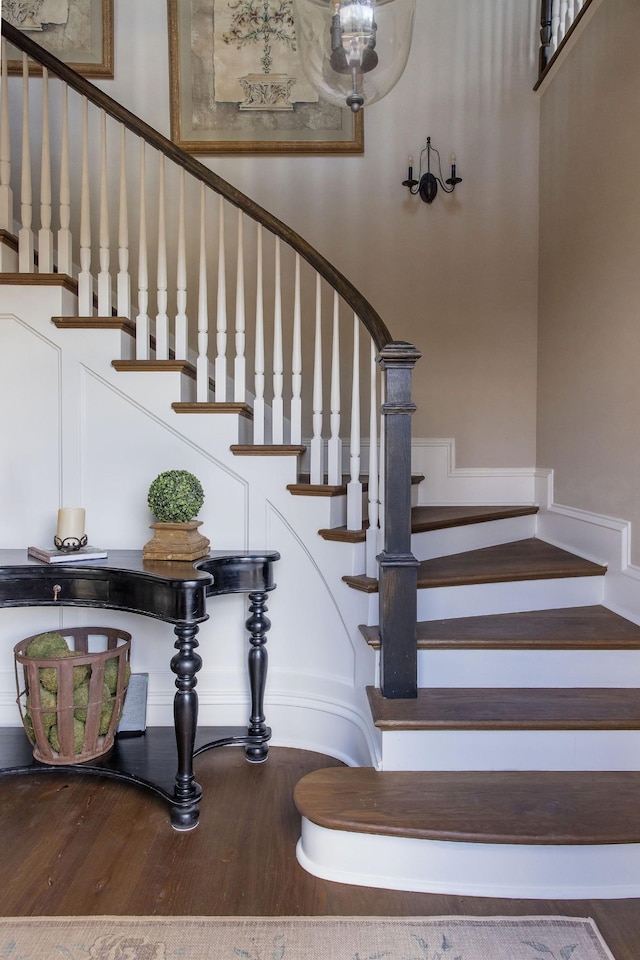 staircase with hardwood / wood-style flooring