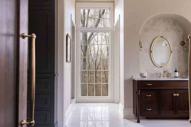 bathroom with tile patterned floors and vanity