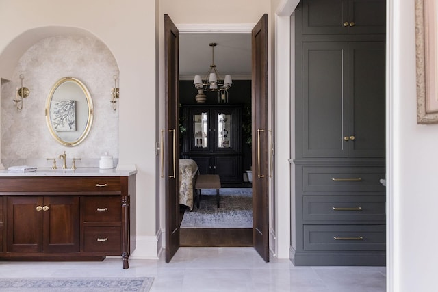 bathroom with vanity and crown molding