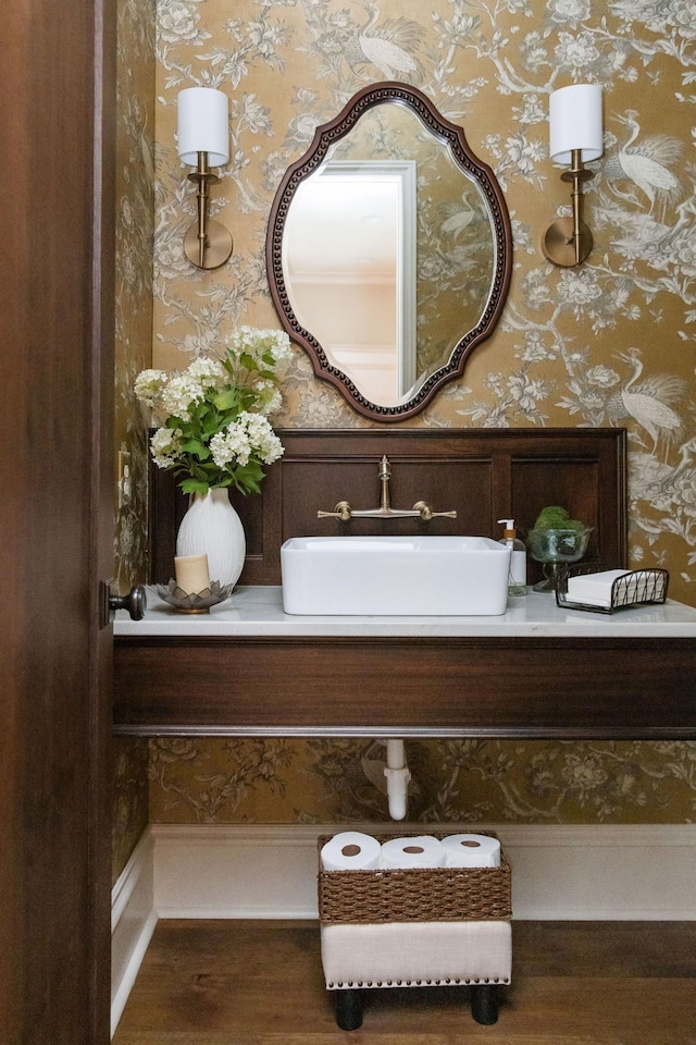 bathroom with vanity and hardwood / wood-style floors