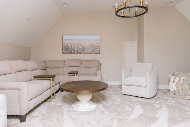 carpeted living room featuring an inviting chandelier and vaulted ceiling