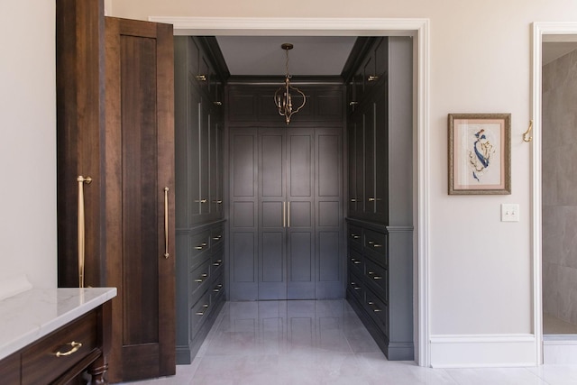 spacious closet featuring light tile patterned floors