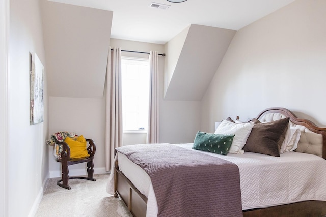 carpeted bedroom with vaulted ceiling