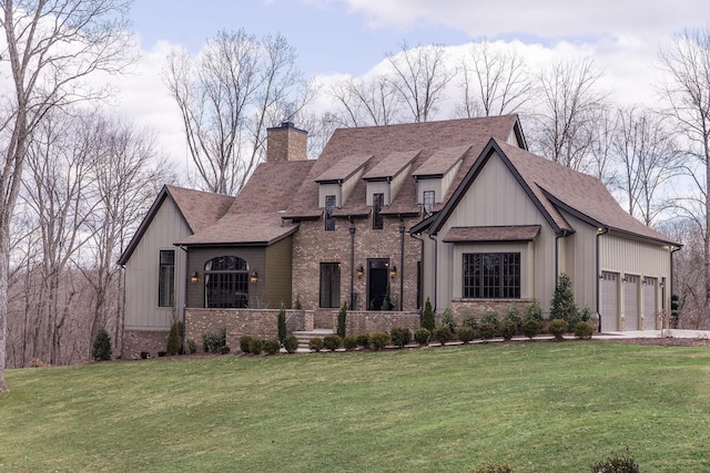 view of front facade with a garage and a front yard