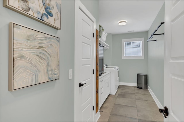 washroom with light tile patterned floors, independent washer and dryer, visible vents, and baseboards