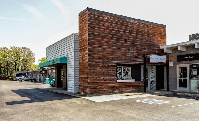 view of property with uncovered parking