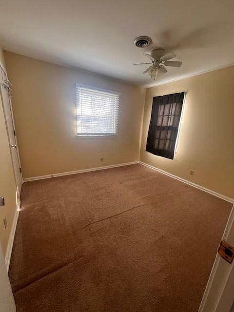 carpeted empty room featuring ceiling fan