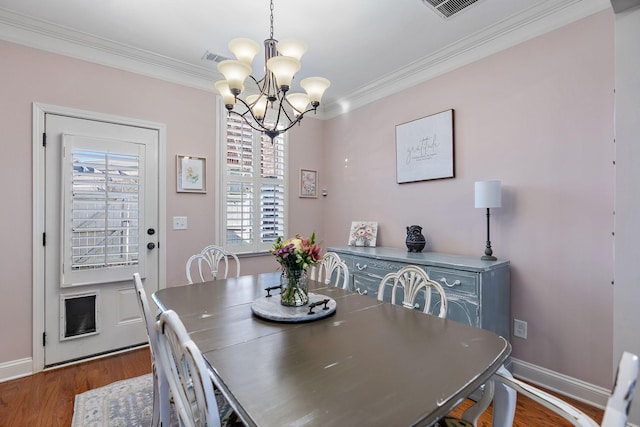 dining room with crown molding, plenty of natural light, and dark wood-type flooring